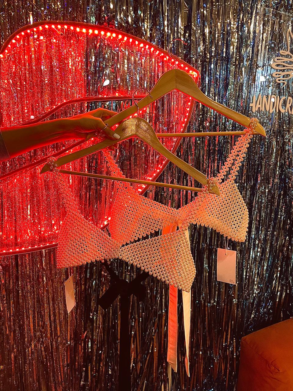 Handcrafted acrylic pearl bralette on model