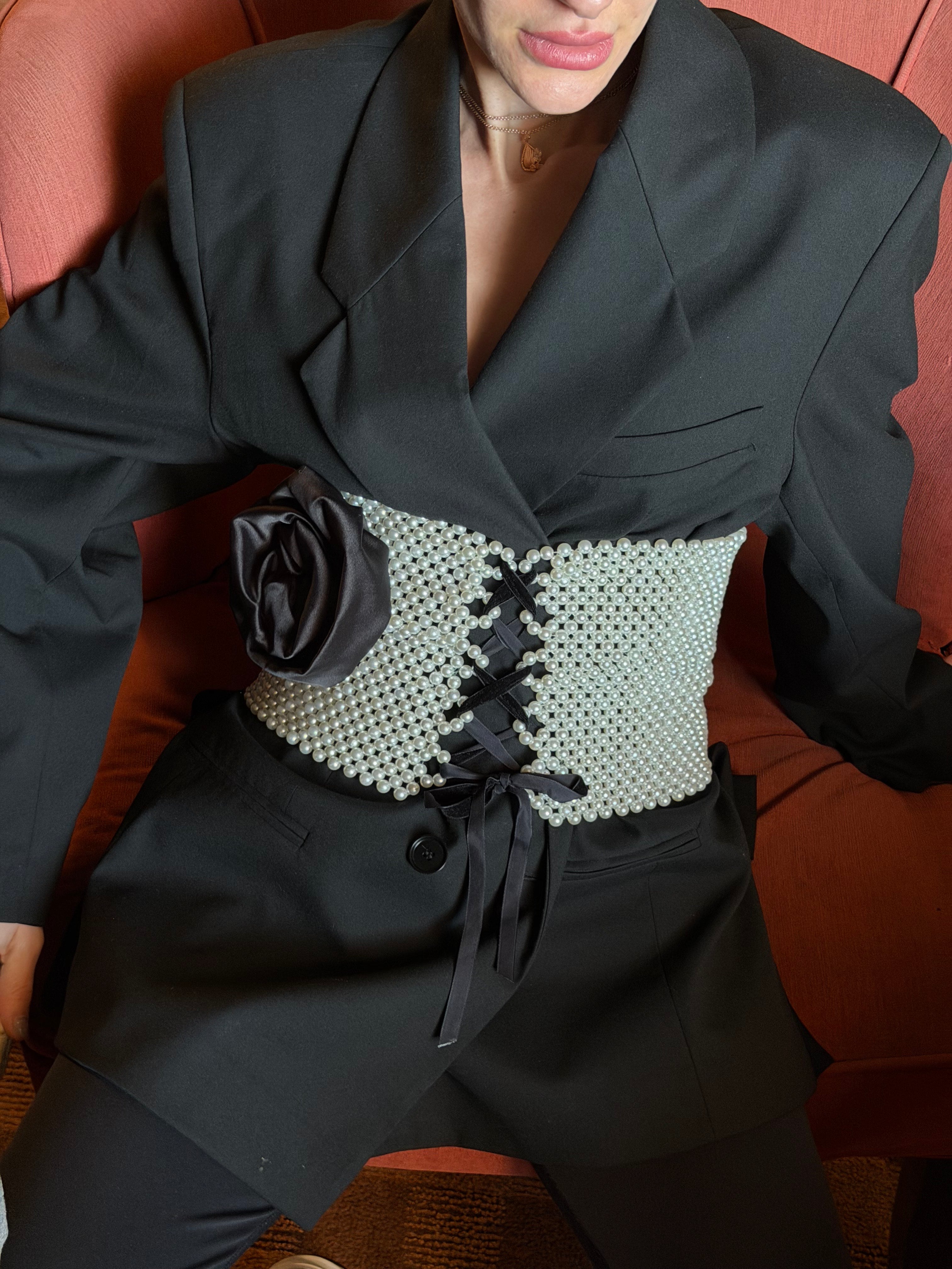 Pearl embellished corset detail close-up